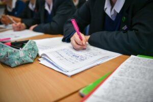 A girl writing in a schoolbook